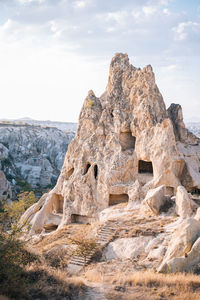 Rock formations on landscape against sky