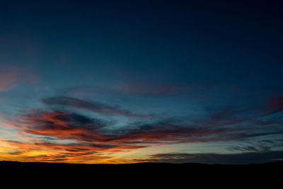 Low angle view of dramatic sky during sunset