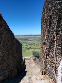 Scenic view of landscape against clear blue sky