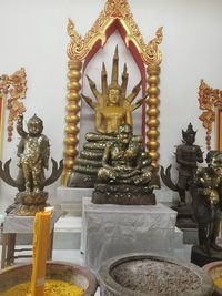 Statue in temple against building