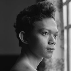 Portrait of young man looking away