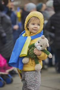 Portrait of smiling young woman standing outdoors