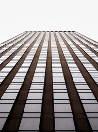 Low angle view of skyscraper against clear sky