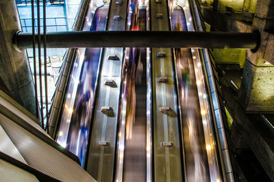 Low angle view of escalator in illuminated building