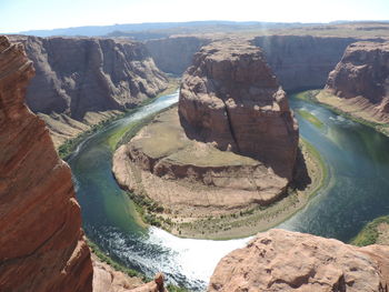 Scenic view of river passing through mountains