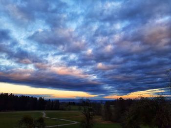 Scenic view of field against sky during sunset