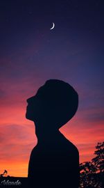 Silhouette man standing against sky at night