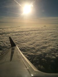 Cropped image of airplane flying over sea