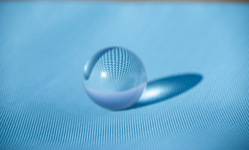 Macro shot of blue ball on table