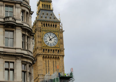 Low angle view of clock tower against sky