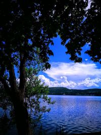 Scenic view of lake against blue sky