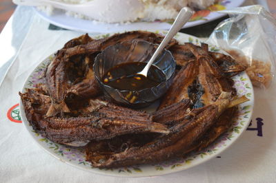 Close-up of fried fish in plate on table