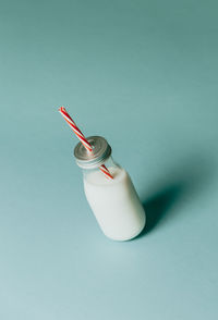 High angle view of bottle against white background