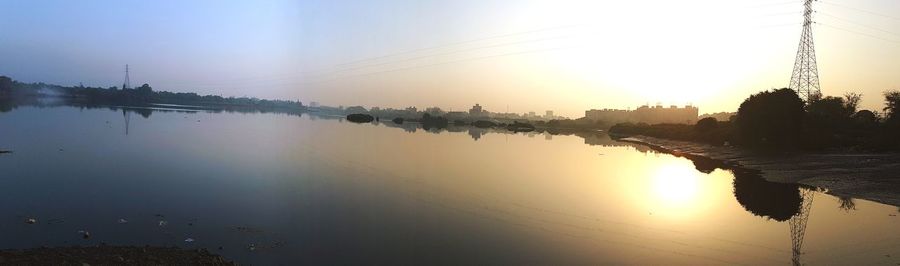 Panoramic view of lake against sky during sunset