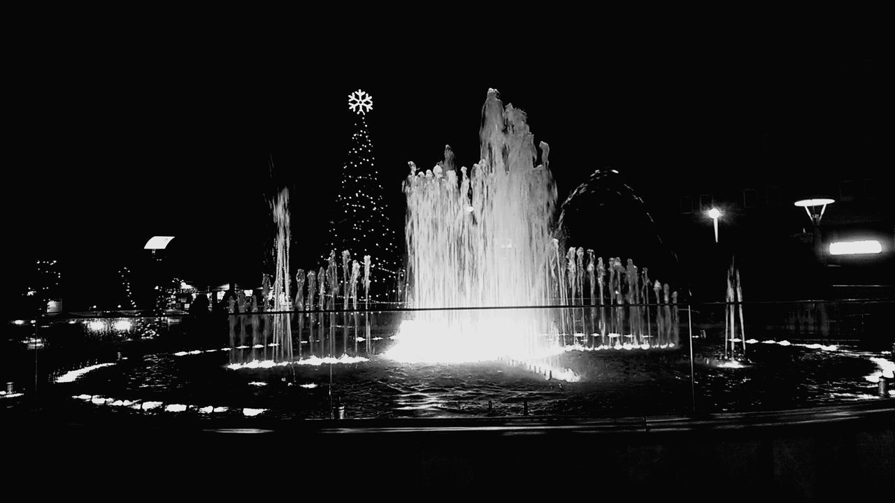 spraying, splashing, fountain, motion, long exposure, arts culture and entertainment, water, night, illuminated, no people, sky, outdoors