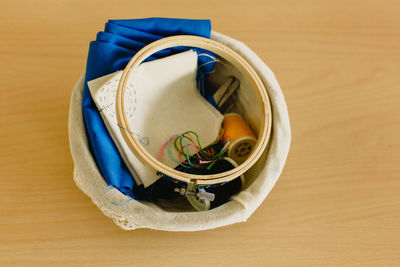 High angle view of blue container on table