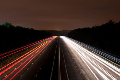 High angle view of light trails at night