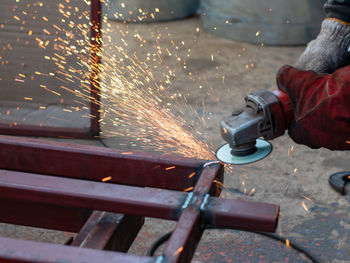 Close-up of worker welding metal