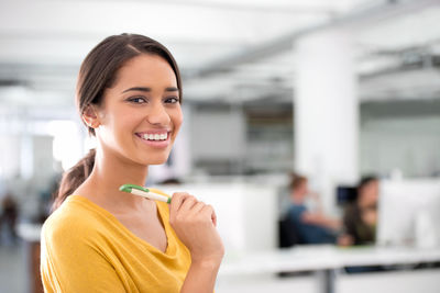 Portrait of happy woman in office