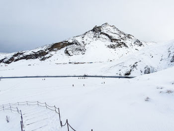 Scenic view of snow covered mountain against sky