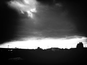 Low angle view of building against cloudy sky