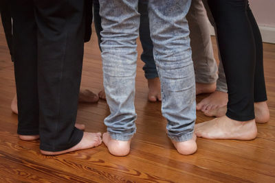 Low section of woman standing on tiled floor