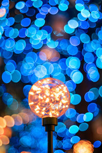 Defocused image of illuminated lights at night