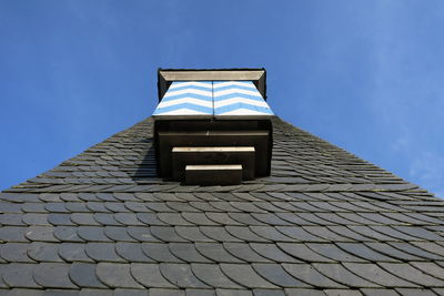 Low angle view of built structure against blue sky