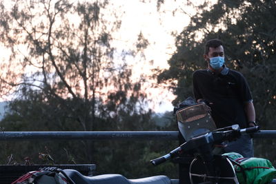 Man riding bicycle on plants