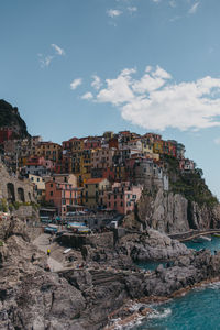 Townscape by sea against sky