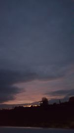 Scenic view of silhouette landscape against sky at sunset