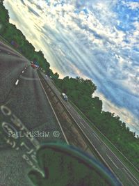 View of road against cloudy sky