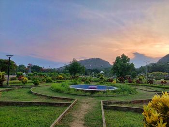 Scenic view of field against sky during sunset