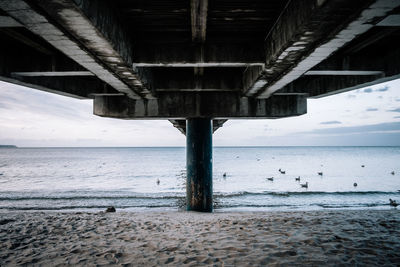 View of pier over sea against sky