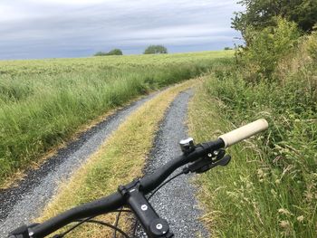 View of bicycle on dirt road