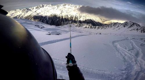 Ski lift over snowcapped mountains