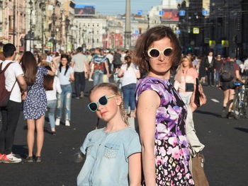 Women standing on street in city