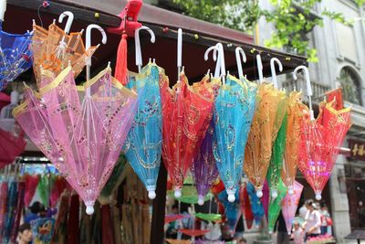 Colorful umbrellas hanging at store for sale