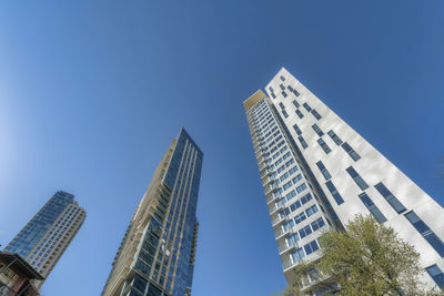 Low angle view of modern buildings against sky