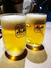 Close-up of beer glass on table