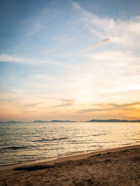 Scenic view of beach against sky during sunset