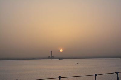 Scenic view of sunset over river