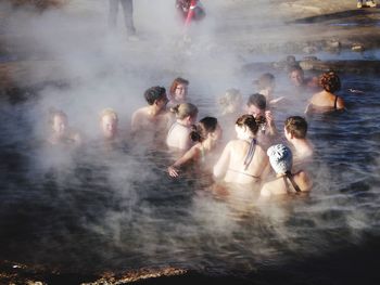 Group of people enjoying in water