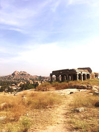 Old ruin on field against sky