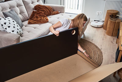 High angle view of woman sleeping on bed at home