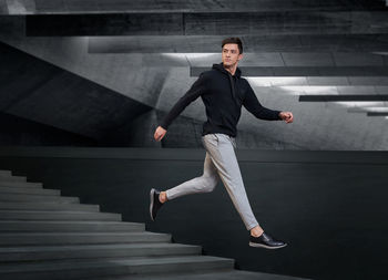 Portrait of young woman exercising in gym