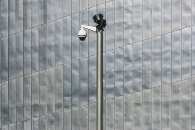 Low angle view of security camera in city