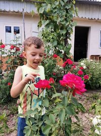 Portrait of cute girl picking flowers