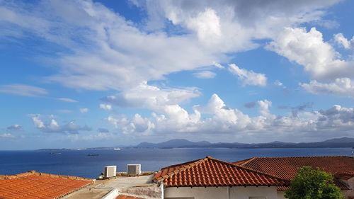 Panoramic view of building by sea against sky