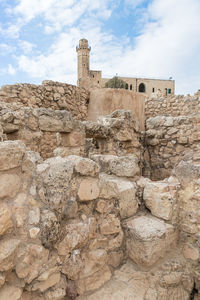 Old ruin building against cloudy sky